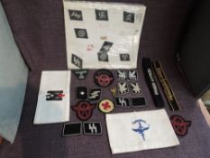 A collection of German WW2 Cloth Badges and four Armbands, SS Divisions included