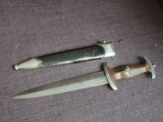 A German WWII SA Service Dagger 1933 with black scabbard, brown grip, blade marked Alles Fur