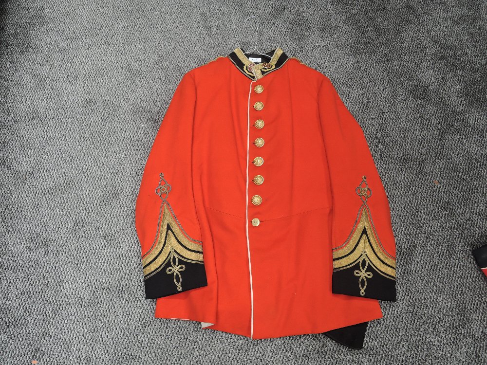 A vintage Red Military Jacket and Trousers for the Liverpool Regiment, 7 brass buttons to front, 3