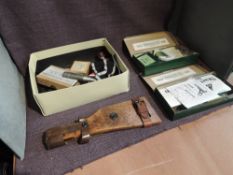 A box containing deactivated bullets, shoulder guard, two Webley & Scott boxes of spares etc