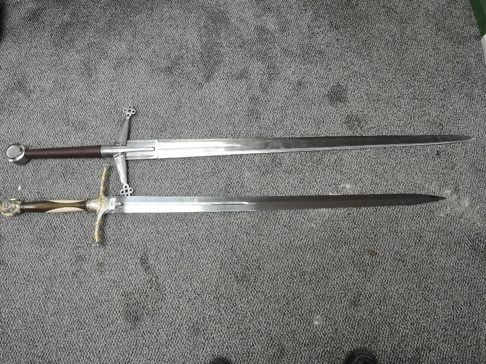 Two modern re-enactment 16th century Two Handed Broadswords, one has plain leather grip, blade len