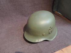 A German WW2 M42 Army Helmet with single decal to left hand side of eagle and swastika, size 59,