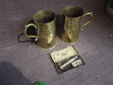 Two Trench Art Shells made into Tankards having Egyptian Design along with a Pocket Edition King