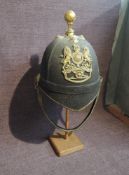 A late 19th/early 20th century Black Cloth Royal Artillery Helmet having brass bowl top crown, brass