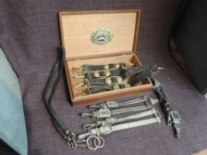 A wooden Cigar box containing British and German Sword and Dagger Hangers