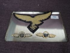 A WW2 German General Gold Cloak Eagle Large Cloth Badge along with a metal German WW2 Luftwaffe