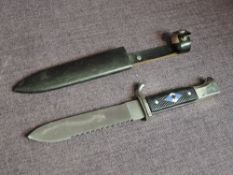 A WW2 German Hitler Youth Dagger having 14cm Saw back blade, emblem on handle, INOX Rostfrie,