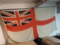 A Royal Navy White Ensign/Battle Flag, rope attached, no marking seen, 130cm x 265cm
