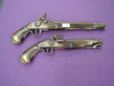 Two Flintlock Pistol, first being a Belt Pistol with ram Rod, brass butt, no marking seen, second