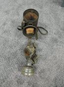 A German WW2 fluted Gas Mask Tin with carry strap containing Gas Mask, spare eye pieces in fitted