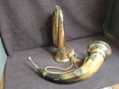 A Kumaon Brass and Copper Bugle along with a Cow Horn having white metal mounts and decoration