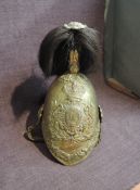 A 7th Dragoons Guards Brass Helmet with chin strap, black plume and leather liner, 1856 marked to
