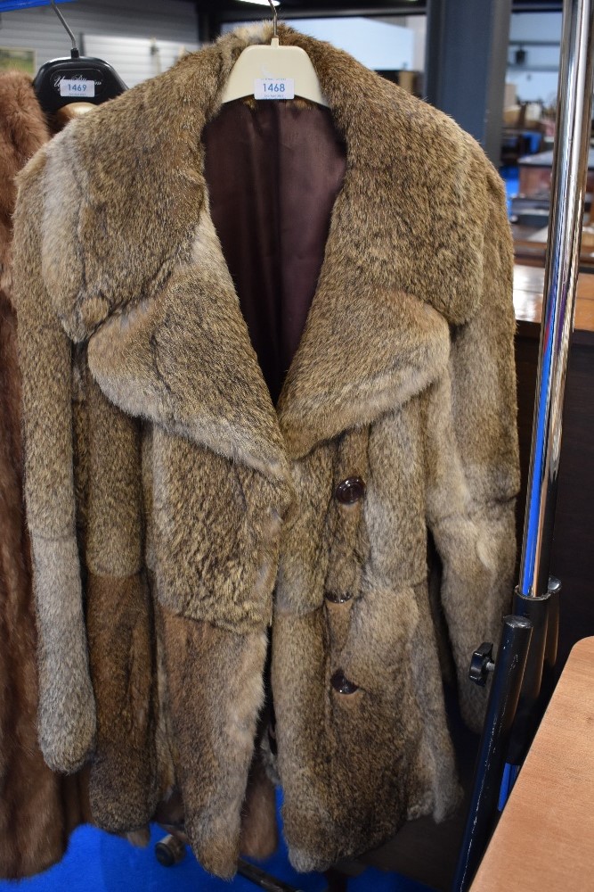 A vintage fur coat, medium to large size.