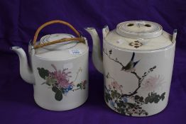 Two oversized Chinese tea pots, one late 19th/early 20th century, the other 20th century, having