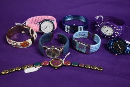 Eight ladies watches in a variety of styles and colours.