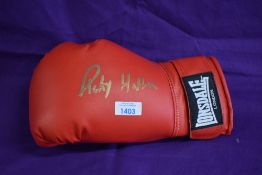 A modern Lonsdale boxing glove bearing printed signature Ricky Hatton