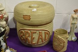 A mid century Tremar bread bin and utensil jar, inner bread bin lid having small chips to inner rim