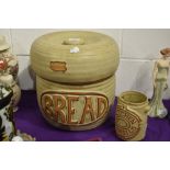 A mid century Tremar bread bin and utensil jar, inner bread bin lid having small chips to inner rim