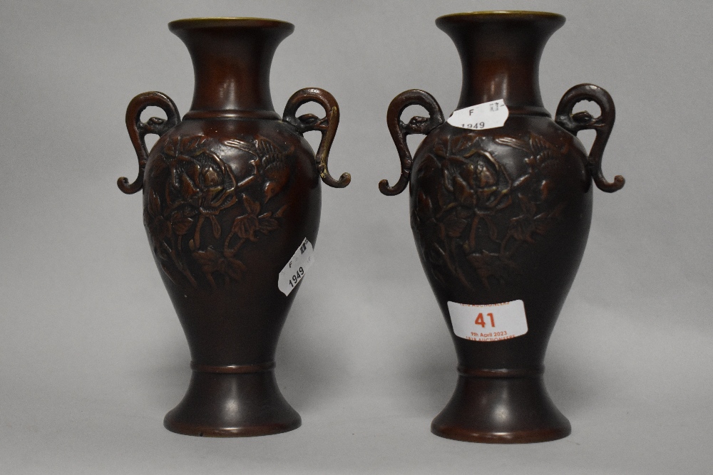 A pair of antique Meiji period Japanese cast bronze vases, decorated with foliage and birds. 19cm