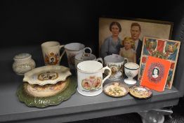 A collection of Royal Coronation memorabilia including cups, dishes and tins.