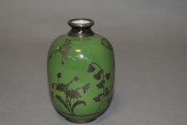 An early 20th century Swiss vase of ovoid form having applied silver floral decoration.