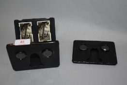 Two small fold out stereoscope cigarette card viewers.