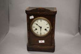 An Edwardian bracket style mantel clock with enamel dial and chime AF.