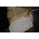 A large box of mixed vintage and retro table linen and similar.