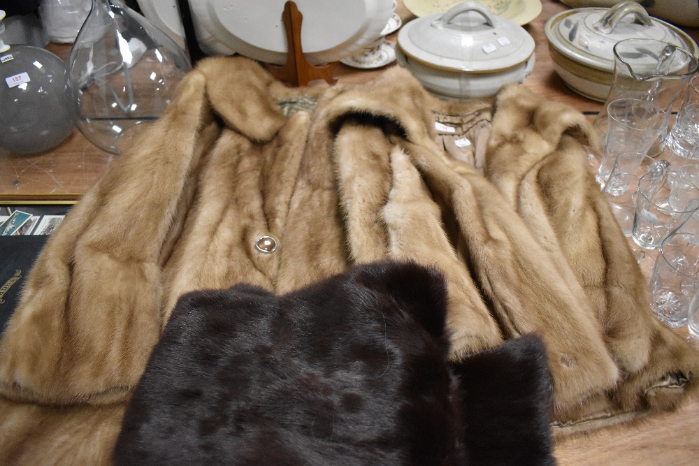 Two vintage ladies fur coats with a similar fur stole.