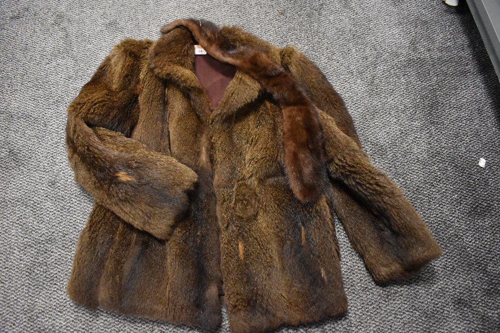 A vintage ladies brown fur coat with a matching stole.