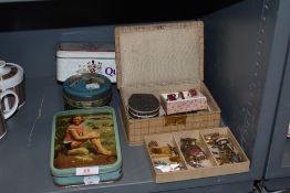 A selection of vintage costume jewellery including clock keys and vintage tins etc.