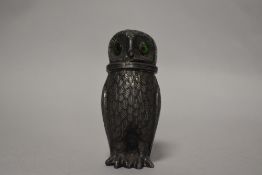 An early 20th century pepper pot in the form of an owl made in pewter.