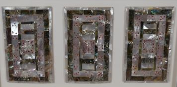 A pair of mounted and framed Mother-of-Pearl and abalone shell triptych panels, reminiscent of