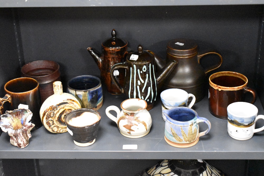 A selection of 20th century studio pottery teapots, mugs and sugar bowls, including highland