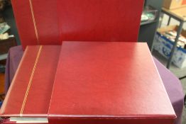 DUO OF SAFE COVER ALBUMS, WITH CASES AND PLENTY OF INSERTS Pair of maroon deluxe Safe cover