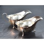 A pair of George V silver sauce boats, of traditional design, marks for Birmingham 1932 and 1934,