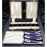 A cased set of six 1930's silver golfing interest teaspoons, having crossed golf club and ball motif