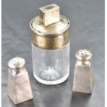 An unusual Victorian silver mounted glass bottle, of cylindrical form, the twist-off cover with