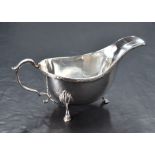 An early Elizabeth II silver gravy boat, of traditional form, marks for London 1957, maker S J