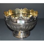 A Victorian silver punch bowl, the rim moulded with repeating arched design over a moulded band