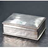 An early 20th century silver cigarette box, of hinged rectangular form with slightly domed cover