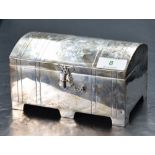 An Edwardian silver jewellery casket, of domed and hinged rectangular form with engraved Laurel,