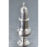 An early George III silver sugar caster, of traditional design with domed and pierced finial
