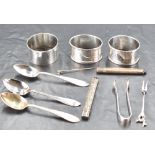 A small selection of miscellaneous silver and white metal items, to include spoons, napkin rings,