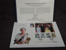 A Queen Elizabeth II Royal Mint 2002 Gold Shield Back Sovereign on large commemorative cover,