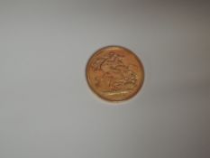 A United Kingdom Royal Mint 2000 Millennium Queen Elizabeth II Gold Sovereign
