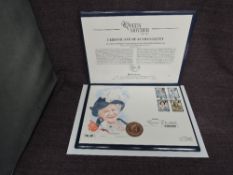 A Queen Elizabeth II Royal Mint 2002 Gold 1oz 5 Pound Coin on large hand painted Life & Times of the