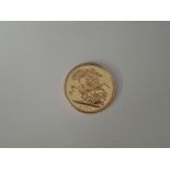 A United Kingdom Royal Mint 2000 Millennium Queen Elizabeth II Gold Sovereign in non original case