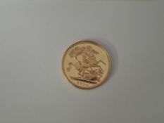 A United Kingdom Royal Mint 2000 Millennium Queen Elizabeth II Gold Sovereign in non original case