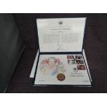 A Queen Elizabeth II Royal Mint 2002 Gold 1oz 5 Pound Coin on large hand painted Queen Golden